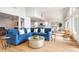 Bright living room with blue sectional sofa and hardwood floors at 1394/96 Pelican Watch Villas, Seabrook Island, SC 29455