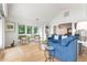 Living room with blue sofa and access to a deck at 1394/96 Pelican Watch Villas, Seabrook Island, SC 29455