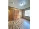 Spacious bedroom with wood-look floors and built-in closet at 313 Pine Needle Rd, Walterboro, SC 29488