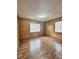 Simple bedroom with wood-look floors and large windows at 313 Pine Needle Rd, Walterboro, SC 29488