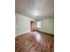 Well-lit bedroom, featuring wood-look floors and a closet at 313 Pine Needle Rd, Walterboro, SC 29488