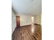 View of living room with wood-look floors and entry door at 313 Pine Needle Rd, Walterboro, SC 29488