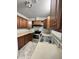 Cozy kitchen with stainless steel appliances and light wood cabinets at 313 Pine Needle Rd, Walterboro, SC 29488