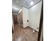 Hallway with laundry area and wood-look floors at 313 Pine Needle Rd, Walterboro, SC 29488