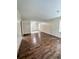 Living room with wood-look floors and wood paneled walls at 313 Pine Needle Rd, Walterboro, SC 29488
