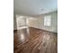 Spacious living room with wood-look floors and wood paneling at 313 Pine Needle Rd, Walterboro, SC 29488