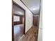 Hallway leading to bedrooms with wood-look floors at 313 Pine Needle Rd, Walterboro, SC 29488