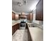 Galley kitchen with stainless steel appliances and wood cabinets at 313 Pine Needle Rd, Walterboro, SC 29488