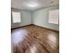 Large bedroom with light walls and wood-look floors at 313 Pine Needle Rd, Walterboro, SC 29488