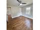 Well-lit bedroom with hardwood floors and ceiling fan at 201 Josie Dr, Walterboro, SC 29488