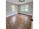 Bedroom with hardwood floors and two windows at 201 Josie Dr, Walterboro, SC 29488
