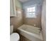 Clean bathroom with a bathtub and shower at 201 Josie Dr, Walterboro, SC 29488