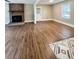Spacious living room with hardwood floors and brick fireplace at 201 Josie Dr, Walterboro, SC 29488