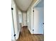 Bright hallway with hardwood floors and access to multiple rooms at 201 Josie Dr, Walterboro, SC 29488