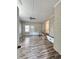 Bonus room with hardwood floors, built-in bench, and brick wall at 201 Josie Dr, Walterboro, SC 29488