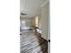 Bonus room with hardwood floors, built-in bench, and brick wall at 201 Josie Dr, Walterboro, SC 29488