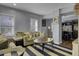 Comfortable living room with beige sofa, striped rug, and round coffee table at 1241 Blue Sky Ln, Charleston, SC 29492