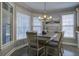 Bright dining area features a farmhouse table with seating for six and lots of natural light at 1241 Blue Sky Ln, Charleston, SC 29492
