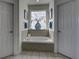 Soaking tub in a bright and airy bathroom at 1241 Blue Sky Ln, Charleston, SC 29492