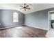 Bright bedroom with vaulted ceiling, large window, and wood-look floors at 215 Cantilever Ct, Summerville, SC 29486