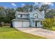 Beautiful two-story home with double garage and landscaped yard at 215 Cantilever Ct, Summerville, SC 29486