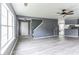 Spacious living room with gray walls, wood-look floors, and a ceiling fan at 215 Cantilever Ct, Summerville, SC 29486