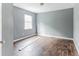 Simple bedroom with gray walls and wood-look floors at 215 Cantilever Ct, Summerville, SC 29486
