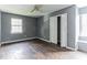 Bedroom with gray walls, wood-look floors, and a spacious closet at 215 Cantilever Ct, Summerville, SC 29486
