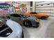 High-end garage with a collection of luxury cars and vintage artwork at 565 Faison Rd # 55, Mount Pleasant, SC 29466