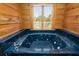 Large corner jacuzzi tub with a window view at 2773 Mt Carmel Rd, Walterboro, SC 29488