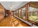 Sunroom with hardwood floors and multiple windows offering ample natural light at 2773 Mt Carmel Rd, Walterboro, SC 29488