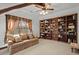 Large library with extensive built-in bookshelves and comfortable seating at 2773 Mt Carmel Rd, Walterboro, SC 29488