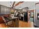 Rustic kitchen with dark wood cabinets, granite countertops, and a breakfast bar at 2773 Mt Carmel Rd, Walterboro, SC 29488