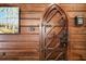 Arched wooden door with intricate iron detailing at 2773 Mt Carmel Rd, Walterboro, SC 29488