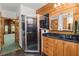 Bathroom with a walk-in shower, double vanity, and dark countertops at 2773 Mt Carmel Rd, Walterboro, SC 29488