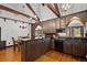 Rustic kitchen with dark wood cabinets, granite countertops, and stainless steel appliances at 2773 Mt Carmel Rd, Walterboro, SC 29488