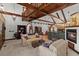 Spacious living area with high ceilings, exposed beams, and fireplace at 2773 Mt Carmel Rd, Walterboro, SC 29488