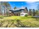 Two-story home showcasing a large backyard and deck at 2773 Mt Carmel Rd, Walterboro, SC 29488