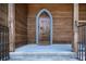 Ornate arched wooden door entrance with iron accents at 2773 Mt Carmel Rd, Walterboro, SC 29488