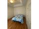 Well-lit bedroom featuring wood flooring and ample closet space at 422 Constance St, Walterboro, SC 29488
