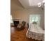 Bright dining area with table, lace tablecloth and access to sunroom at 422 Constance St, Walterboro, SC 29488