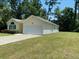 House exterior showcasing a large yard and white garage at 422 Constance St, Walterboro, SC 29488