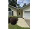 House entrance with walkway and lush green shrubs at 422 Constance St, Walterboro, SC 29488