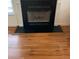 Close-up of a black fireplace with a wood mantel at 422 Constance St, Walterboro, SC 29488