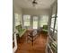 Sunroom with hardwood floors, ceiling fan, and French doors at 422 Constance St, Walterboro, SC 29488