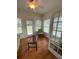 Sunroom with hardwood floors, ceiling fan, and French doors at 422 Constance St, Walterboro, SC 29488