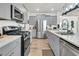 Modern kitchen with stainless steel appliances and gray cabinets at 120 Haverhill St, Summerville, SC 29486