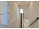 Upstairs hallway with carpeted floor and access to bedrooms and bathrooms at 2193 Blue Bayou Blvd, Johns Island, SC 29455