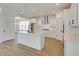 Modern kitchen with white cabinets, center island, and stainless steel appliances at 2193 Blue Bayou Blvd, Johns Island, SC 29455