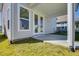 Covered back patio with French doors and access to backyard at 2193 Blue Bayou Blvd, Johns Island, SC 29455